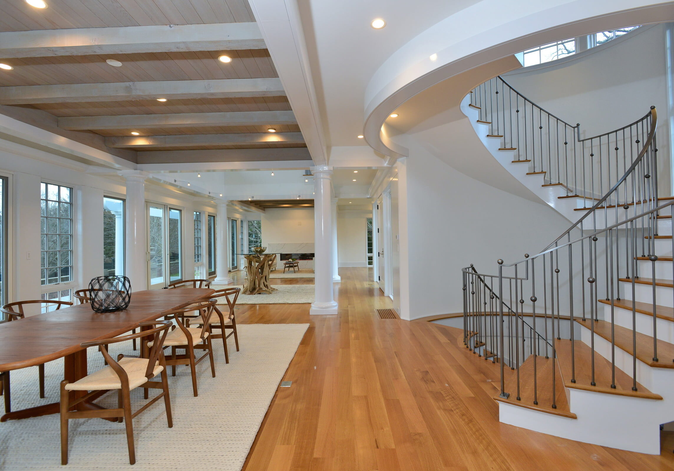 Interior image of Newport Rhode Island waterfront home with dining room and staircase